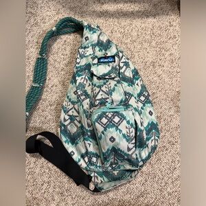 teal and mint green kavu sling bag